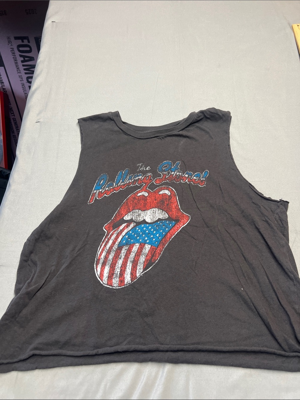 the Rolling Stones Black Tank with Red Lips and Blue Stars Graphic
